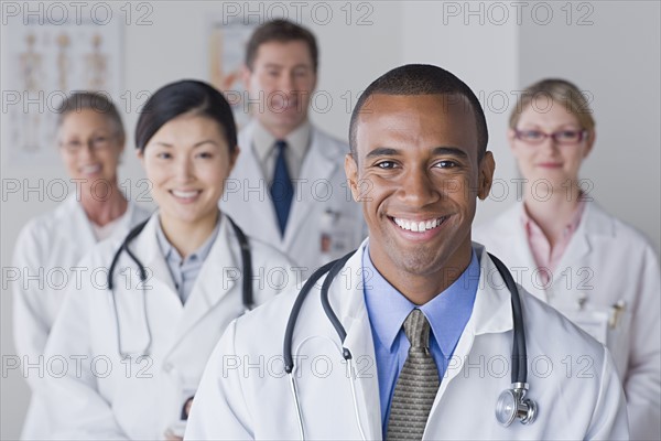 Group portrait of smiling doctors. Photo : Rob Lewine