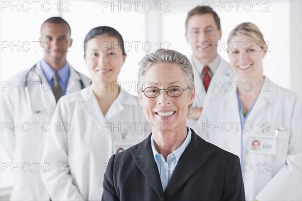 Group portrait of smiling doctors. Photo : Rob Lewine