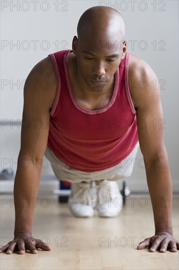 Close up of man doing push-ups. Photo: Rob Lewine