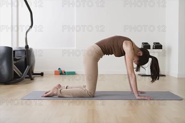 Woman in yoga pose. Photo : Rob Lewine