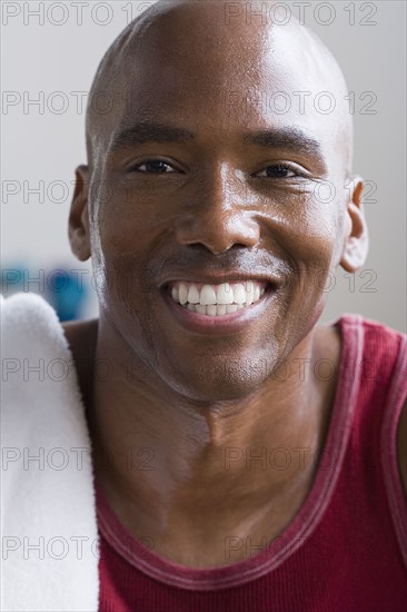 Portrait of male athlete smiling. Photo : Rob Lewine