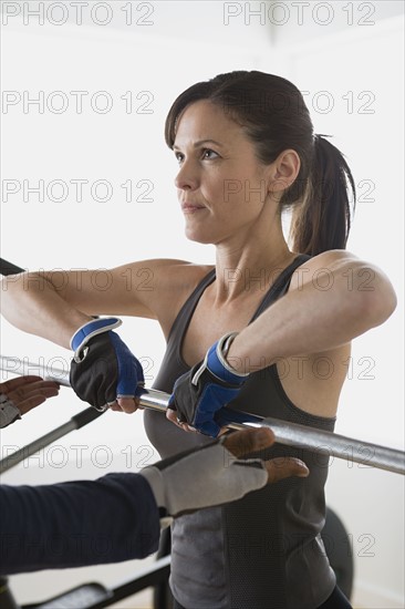 Woman lifting barbell. Photo: Rob Lewine