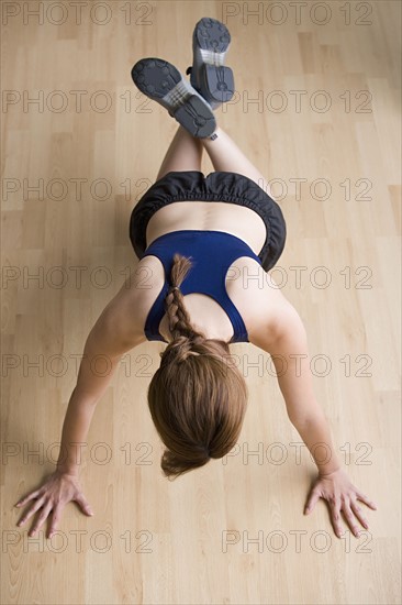 Woman doing push-ups. Photo: Rob Lewine