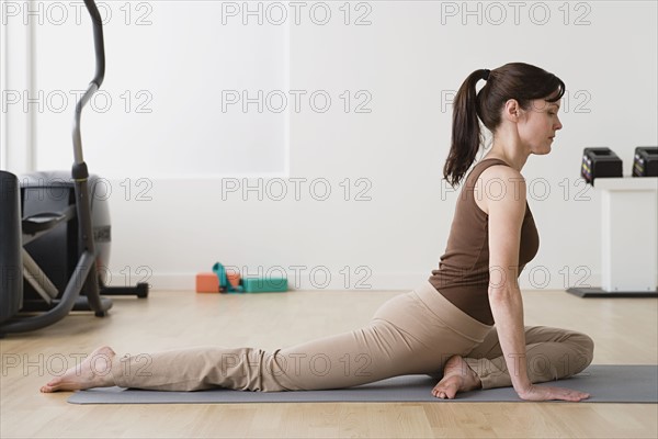 Woman in yoga pose. Photo : Rob Lewine