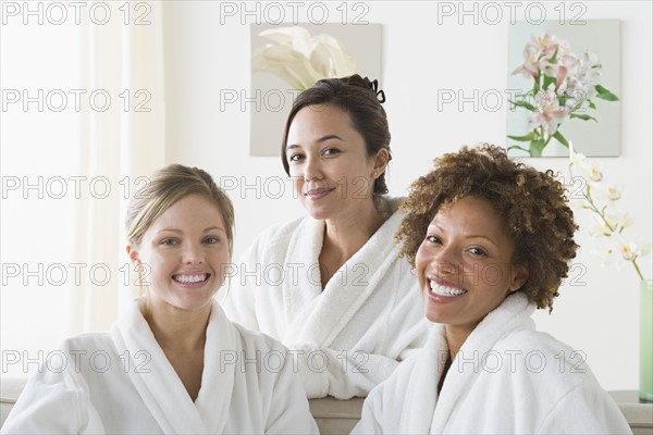 Portrait of three attractive women relaxing in spa. Photo : Rob Lewine