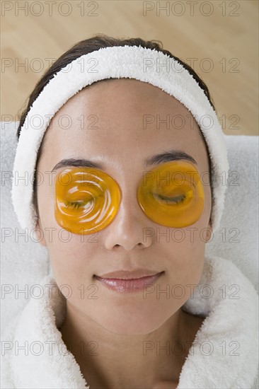 Woman relaxing with eye cooling mask. Photo : Rob Lewine