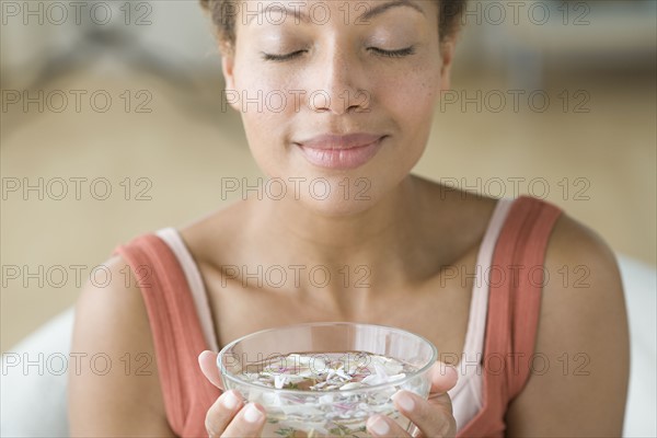 Woman enjoying aromatherapy. Photo : Rob Lewine