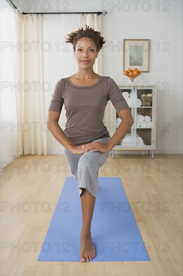 Woman exercising at home. Photo: Rob Lewine