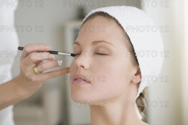 Woman having make-up applied. Photo: Rob Lewine