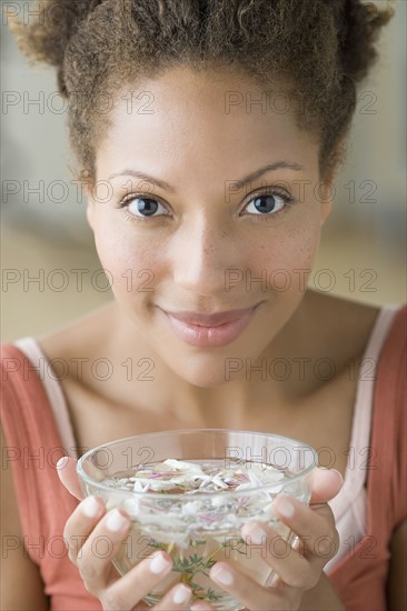 Woman enjoying aromatherapy. Photo : Rob Lewine