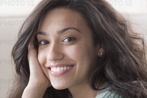 Portrait of young woman smiling. Photo : Rob Lewine