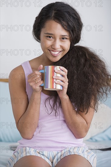Woman holding mug. Photo: Rob Lewine