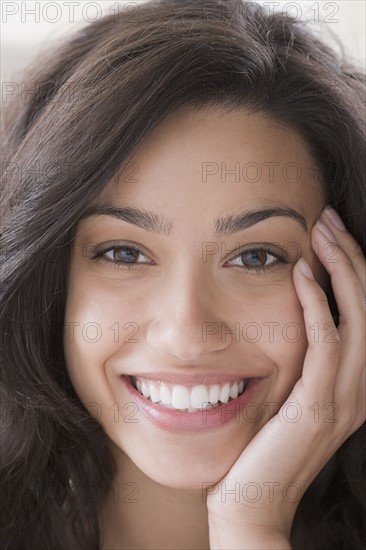 Portrait of young woman smiling. Photo : Rob Lewine