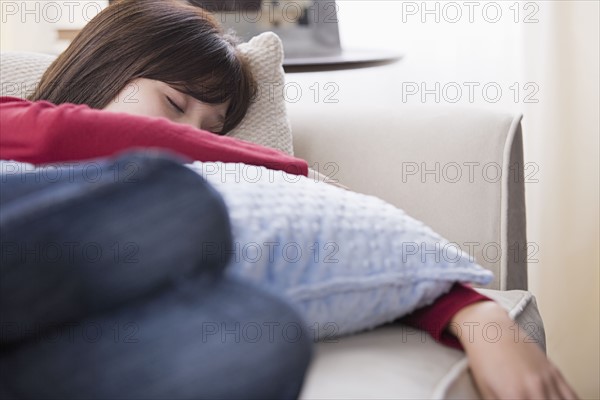 Woman sleeping o sofa. Photo : Rob Lewine