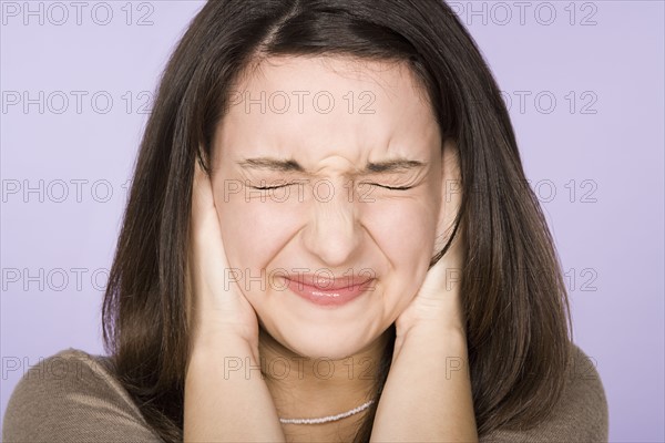 Portrait of teenage girl (16-17) making face. Photo: Rob Lewine