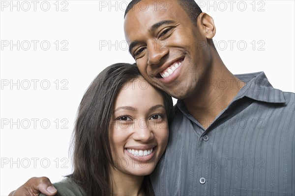 Studio portrait of young couple. Photo : Rob Lewine