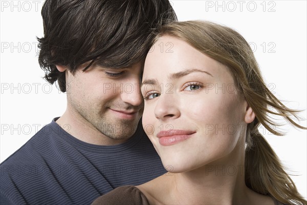 Studio portrait of young couple. Photo : Rob Lewine