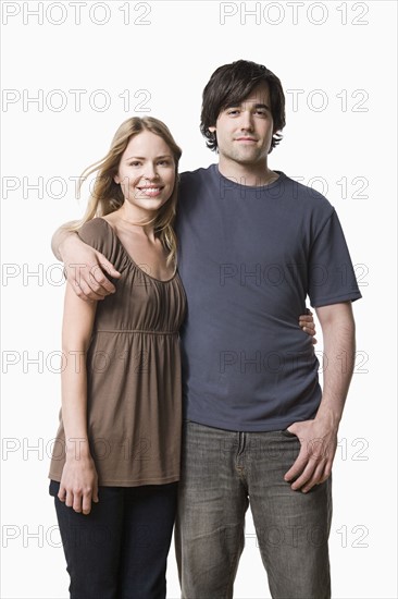 Studio portrait of young couple. Photo : Rob Lewine