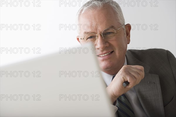 Portrait of mature businessman. Photo : Rob Lewine