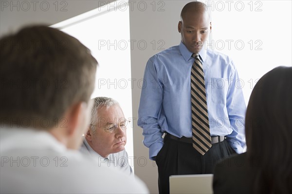 Businessmen in office. Photo : Rob Lewine