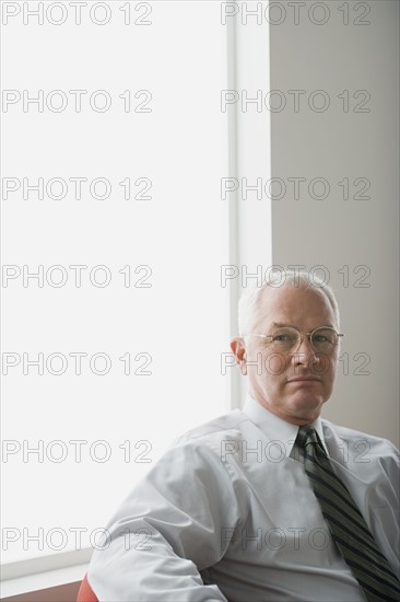 Portrait of mature businessman. Photo : Rob Lewine