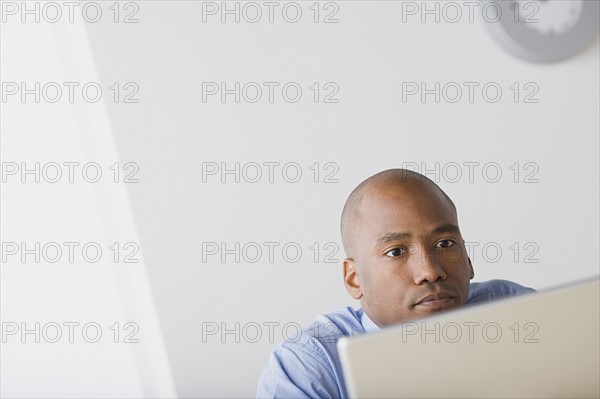 Businessman in office. Photo : Rob Lewine