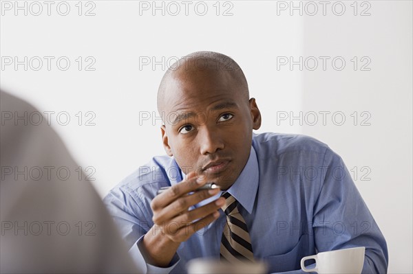 Businessman in office. Photo : Rob Lewine