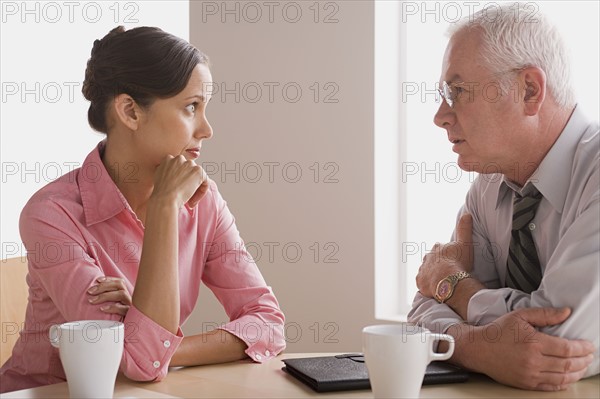 Business people talking in office. Photo : Rob Lewine