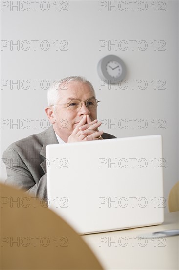 Portrait of mature businessman contemplating. Photo: Rob Lewine
