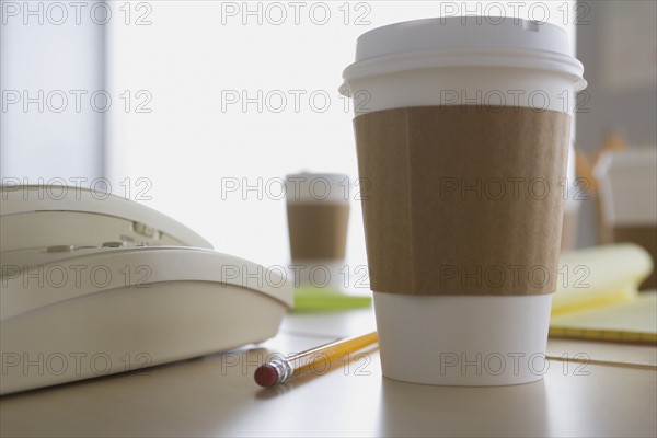 Plastic coffee cup on desk. Photo: Rob Lewine