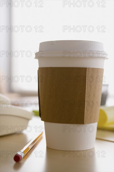 Plastic coffee cup on desk. Photo: Rob Lewine