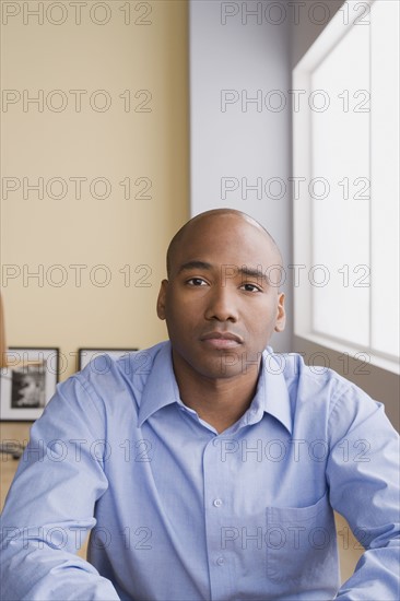 Portrait of mid adult businessman. Photo : Rob Lewine