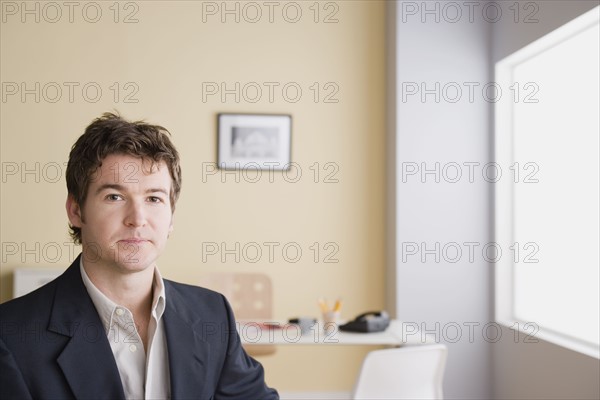 Portrait of young businessman. Photo : Rob Lewine