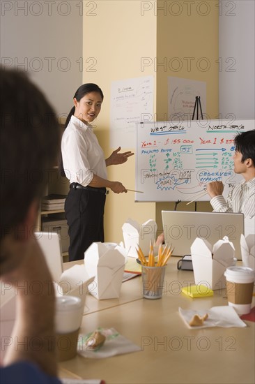 Group of businesspeople in meeting. Photo : Rob Lewine