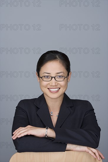 Portrait of happy young businesswoman. Photo : Rob Lewine