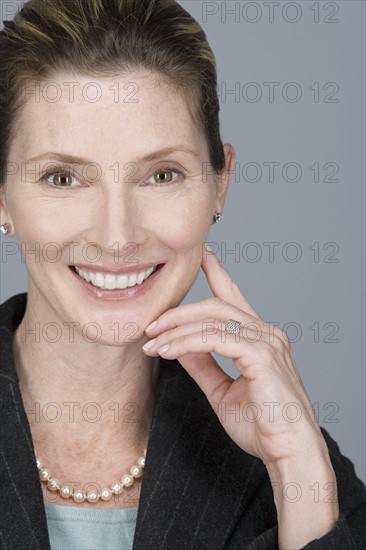 Portrait of happy mature businesswoman. Photo : Rob Lewine