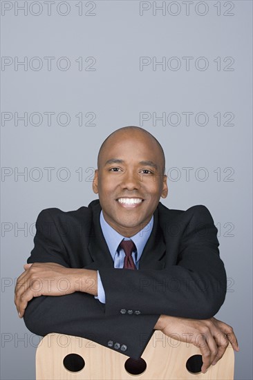 Portrait of happy mid adult businessman. Photo : Rob Lewine