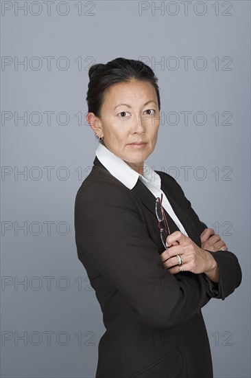 Portrait of happy mature businesswoman. Photo : Rob Lewine