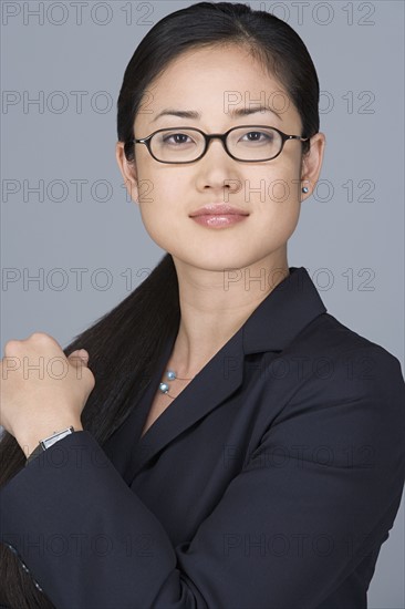 Portrait of cheerful businesswoman. Photo : Rob Lewine