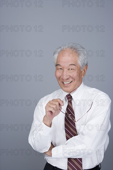 Portrait of happy senior businessman. Photo: Rob Lewine
