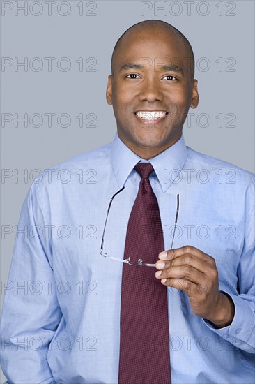 Portrait of mid adult businessman. Photo : Rob Lewine