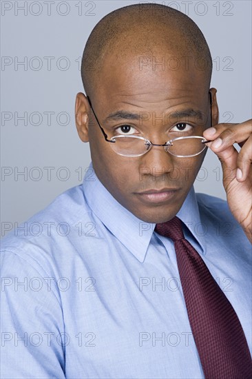 Portrait of mid adult businessman. Photo : Rob Lewine