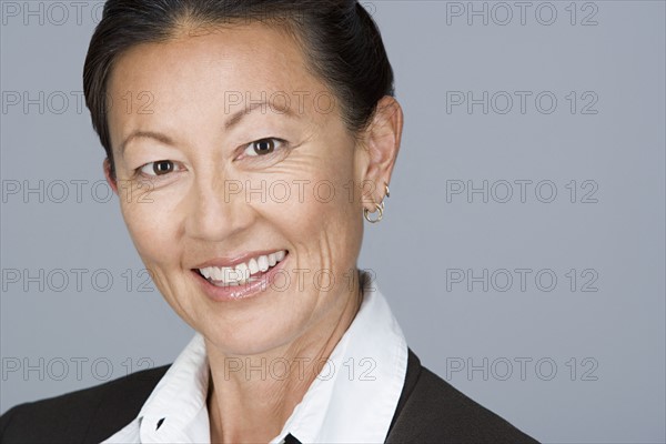 Portrait of happy mature businesswoman. Photo : Rob Lewine