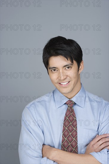Portrait of happy young businessman. Photo : Rob Lewine
