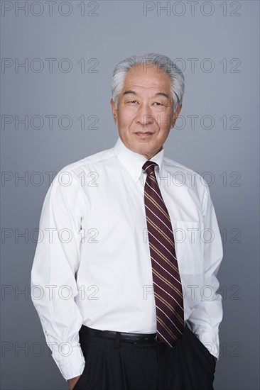 Portrait of happy senior businessman. Photo : Rob Lewine