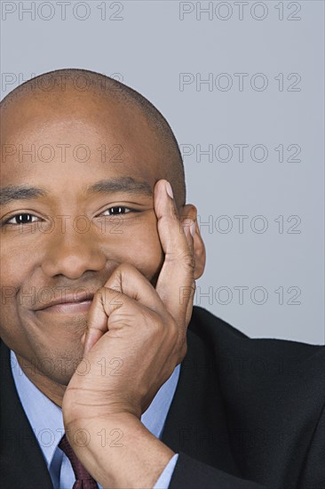 Portrait of happy mid adult businessman. Photo : Rob Lewine