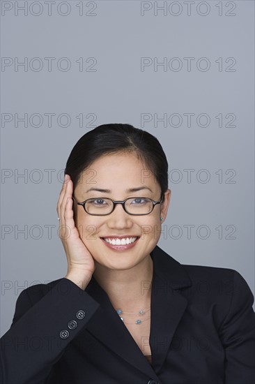 Portrait of happy young businesswoman. Photo : Rob Lewine