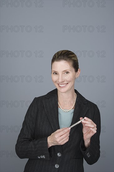 Portrait of happy mature businessman. Photo: Rob Lewine