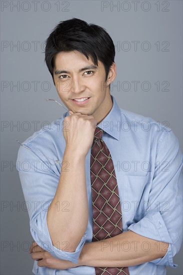 Portrait of happy young businessman. Photo : Rob Lewine