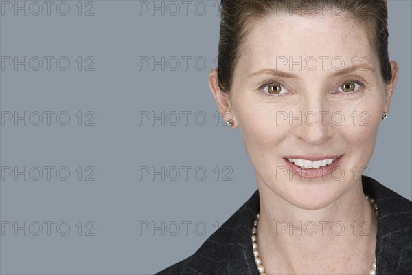 Portrait of happy mature businessman. Photo : Rob Lewine